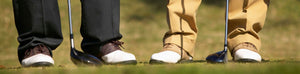 2 golfers' shoes and clubs