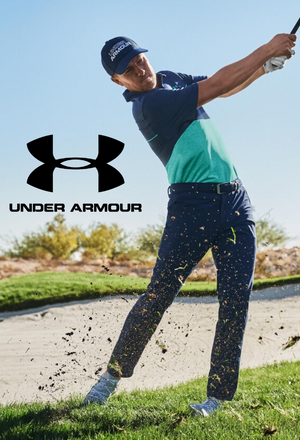 Golfer mid swing wearing Under Armour golf attire